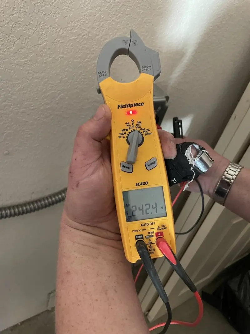 Voltage testing with clamp meter during Ceiling Fan Installation in Tabernacle